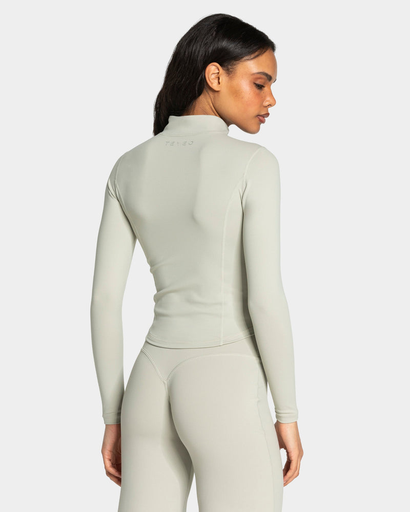 Veste de sport zippée sculptante Allrounder « pistache/dorée »